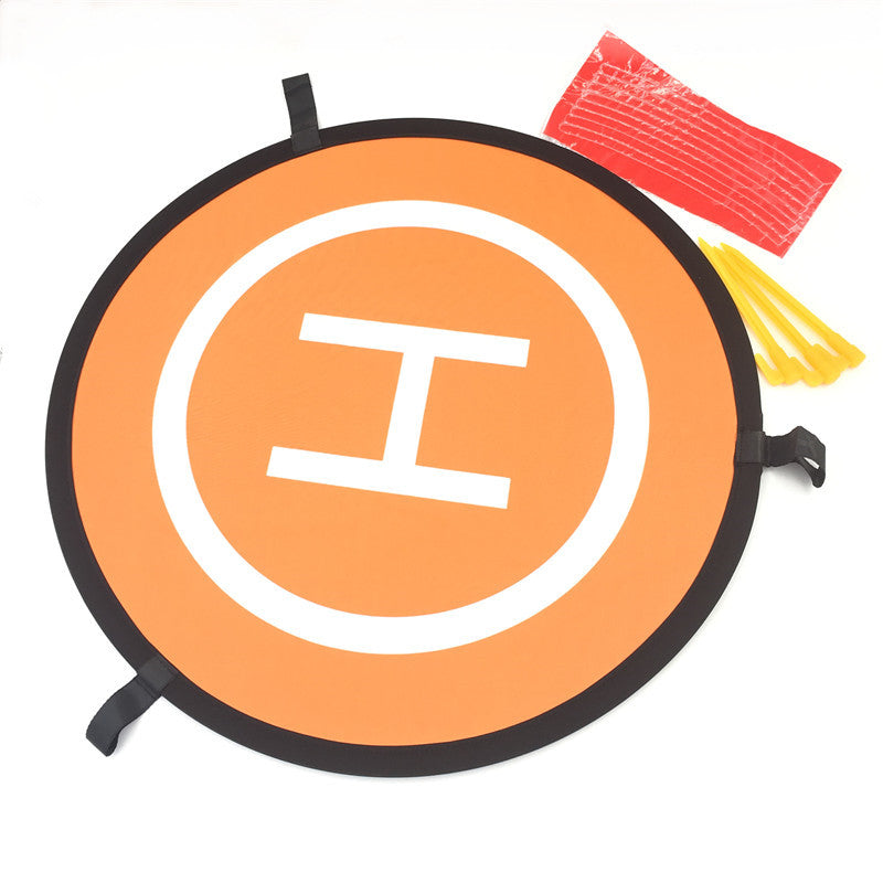 Orange foldable 55cm drone landing pad with ground stakes